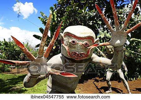 Stock Photography - The mud men, also called Mud Man of Asaro with their martial masks of clay, Goroka, in the highlands of Papua New Guinea. Fotosearch