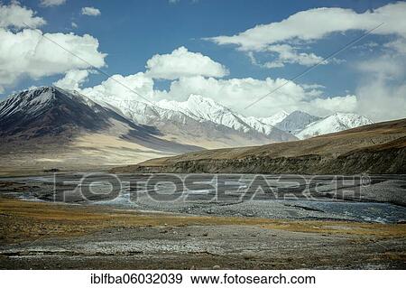 The Wachandarja River meanders through a wide gravel bed on a plateau of the Wakhan Corridor near Bozai Gumbaz, in the background the snow-covered peaks of the Hindu Kush forming the border with Pakistan, Wakhan Corridor, Badakhshan, Afghanistan, Asia View Large Photo Image Stock Photo - The Wachandarja River meanders through a wide gravel bed on a plateau of the Wakhan Corridor near Bozai Gumbaz, in the background the snow-covered peaks of the Hindu Kush forming the border with Pakistan, Wakhan Corridor, Badakhshan, Afghanistan, Asia. Fotosearch
