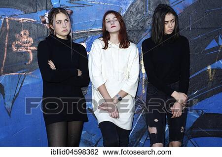 Three girls, teenagers, rebels, bad mood, negative, negative mood, boycott, boycott, relationship, friends, piercing, quarrel, graffiti View Large Photo Image Stock Image - Three girls, teenagers, rebels, bad mood, negative, negative mood, boycott, boycott, relationship, friends, piercing, quarrel, graffiti. Fotosearch