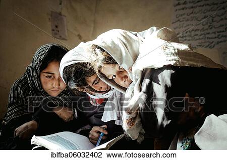 Three girls working with a textbook, Potokh Primary School, Potokh, Wakhan Corridor, Afghanistan, Asia View Large Photo Image Stock Image - Three girls working with a textbook, Potokh Primary School, Potokh, Wakhan Corridor, Afghanistan, Asia. Fotosearch