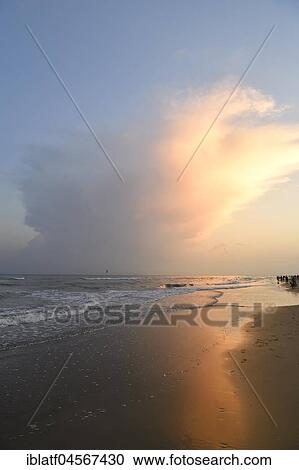 Stock Image - Thundercloud over the sea, storm front, sandy beach, Bibione, Adriatic Sea, Veneto, Italy, Europe. Fotosearch
