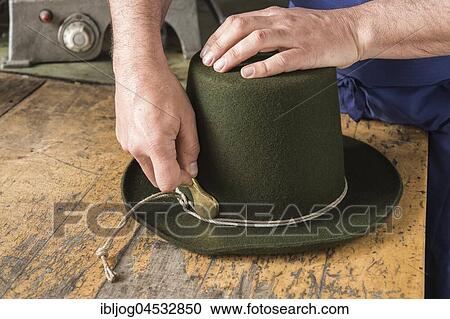 Tightening the shaping cord around a wool felt hat, using iron tool, hatmaker workshop, Bad Aussee, Styria, Austria, Europe View Large Photo Image Stock Image - Tightening the shaping cord around a wool felt hat, using iron tool, hatmaker workshop, Bad Aussee, Styria, Austria, Europe. Fotosearch