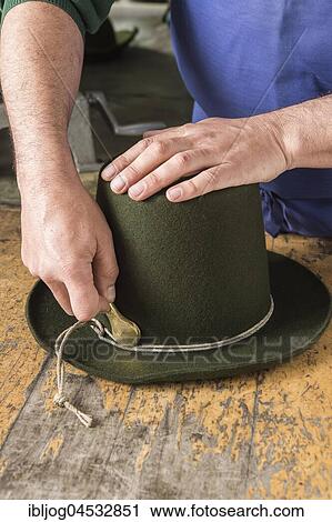 Tightening the shaping cord around a wool felt hat, using iron tool, hatmaker workshop, Bad Aussee, Styria, Austria, Europe View Large Photo Image Stock Image - Tightening the shaping cord around a wool felt hat, using iron tool, hatmaker workshop, Bad Aussee, Styria, Austria, Europe. Fotosearch