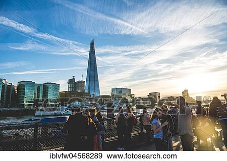 Torists, Riverside promenade on the Thames, Tower Pier, Skyline, The Shard, at sunset, Southwark, London, England, United Kingdom, Europe View Large Photo Image Stock Photo - Torists, Riverside promenade on the Thames, Tower Pier, Skyline, The Shard, at sunset, Southwark, London, England, United Kingdom, Europe. Fotosearch