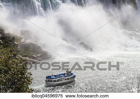 Tourist boat in front of waterfall, American Falls, Niagara Falls, Ontario, Canada, North America View Large Photo Image Stock Photography - Tourist boat in front of waterfall, American Falls, Niagara Falls, Ontario, Canada, North America. Fotosearch