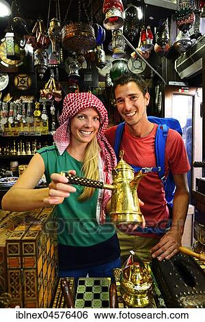 Stock Photograph - Tourist buy souvenirst, Al Balat, Amman, Jordan, Asia. Fotosearch