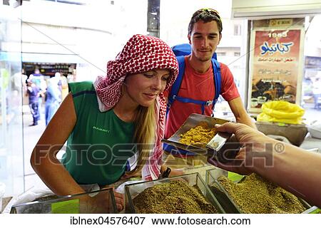 Stock Photo - Tourist buys spices, Al Balat, Amman, Jordan, Asia. Fotosearch