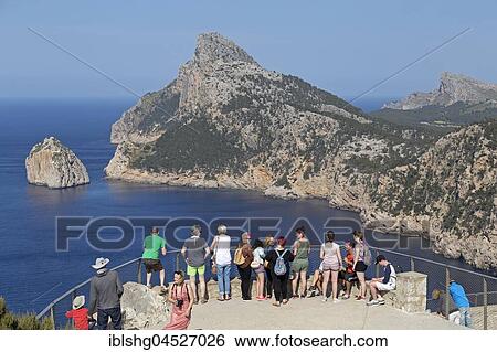 Tourists at the viewpoint, Mirador d' Es Colomer, also Mirador del Mal Pas, Peninsula Formentor, Majorca, Spain, Europe View Large Photo Image Stock Photograph - Tourists at the viewpoint, Mirador d' Es Colomer, also Mirador del Mal Pas, Peninsula Formentor, Majorca, Spain, Europe. Fotosearch