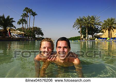 Tourists bath in Pool of Mövenpick Dead Sea Resort, Jordan, Asia View Large Photo Image Stock Photograph - Tourists bath in Pool of Mövenpick Dead Sea Resort, Jordan, Asia. Fotosearch
