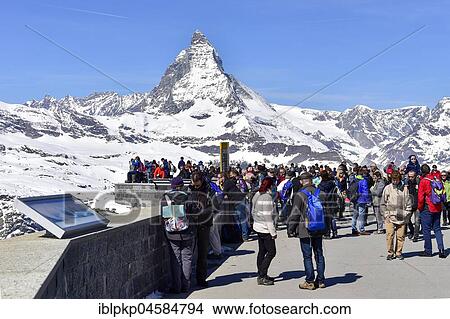 Tourists on the Gornergrat ridge with Matterhorn in the background, Zermatt, Switzerland, Europe View Large Photo Image Picture - Tourists on the Gornergrat ridge with Matterhorn in the background, Zermatt, Switzerland, Europe. Fotosearch