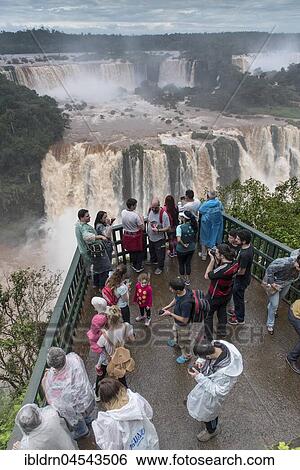 Stock Photograph - Tourists on viewing platform, Iguazú Falls, Foz do Iguaçu, Paraná, Brazil, South America. Fotosearch