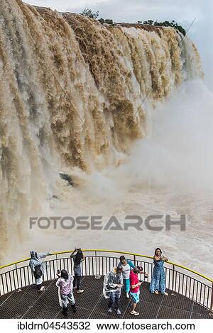 Tourists take photos on viewing platform, Iguazú Falls, Foz do Iguaçu, Paraná, Brazil, South America View Large Photo Image Stock Image - Tourists take photos on viewing platform, Iguazú Falls, Foz do Iguaçu, Paraná, Brazil, South America. Fotosearch