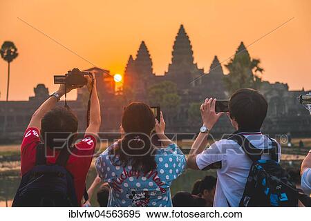 Tourists take pictures Angkor Wat, Sunrise, Angkor Wat, Angkor Archaeological Park, Province Siem Reap, Cambodia, Asia View Large Photo Image Stock Photography - Tourists take pictures Angkor Wat, Sunrise, Angkor Wat, Angkor Archaeological Park, Province Siem Reap, Cambodia, Asia. Fotosearch