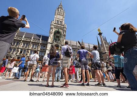Tourists watching chime, New town hall, Marienplatz, old town, Munich, Upper Bavaria, Bavaria, Germany, Europe View Large Photo Image Stock Image - Tourists watching chime, New town hall, Marienplatz, old town, Munich, Upper Bavaria, Bavaria, Germany, Europe. Fotosearch