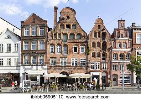 Stock Image - Town houses Am Sande, North German brick houses with stepped gables, Lüneburg, Lower Saxony, Germany, Europe. Fotosearch