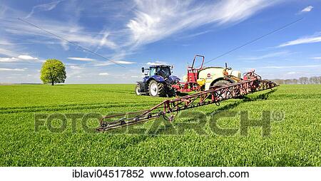 Tractor with sprayer spraying pesticides, cereal field in spring, Saxony-Anhalt, Germany, Europe View Large Photo Image Stock Image - Tractor with sprayer spraying pesticides, cereal field in spring, Saxony-Anhalt, Germany, Europe. Fotosearch