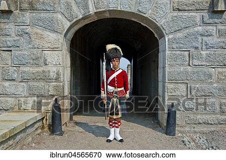 Stock Image - Traditional dressed guard, Fort George, Citadel Hill, Halifax, Nova Scotia, Canada, North America. Fotosearch