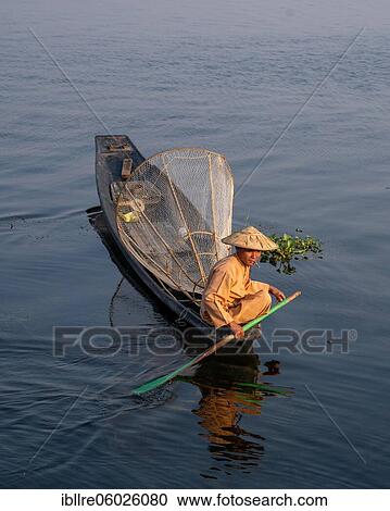 Traditional fisherman on his small boat, Lake Inle, Myanmar, Asia View Large Photo Image Stock Image - Traditional fisherman on his small boat, Lake Inle, Myanmar, Asia. Fotosearch