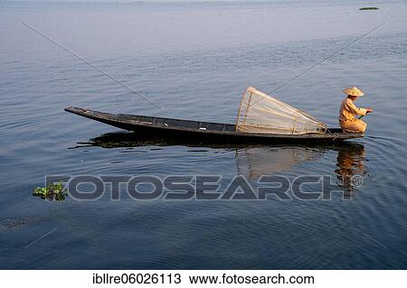 Traditional fisherman on his small boat, Lake Inle, Myanmar, Asia View Large Photo Image Stock Image - Traditional fisherman on his small boat, Lake Inle, Myanmar, Asia. Fotosearch