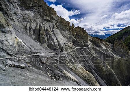 Trekking route to Tilicho Lake, crossing mountain slopes, Upper Marsyangdi valley, Manang District, Nepal, Asia View Large Photo Image Picture - Trekking route to Tilicho Lake, crossing mountain slopes, Upper Marsyangdi valley, Manang District, Nepal, Asia. Fotosearch
