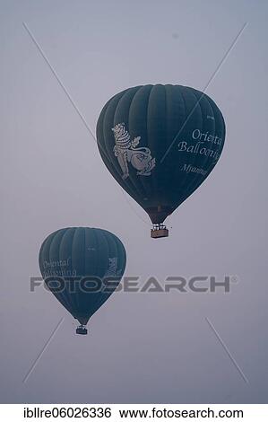 Stock Photograph - Two blue balloons in the air, Bagan, Myanmar, Asia. Fotosearch