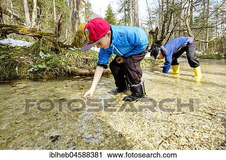 Two boys in a brook, Bischofswiesen, Bavaria, Germany, Europe View Large Photo Image Stock Image - Two boys in a brook, Bischofswiesen, Bavaria, Germany, Europe. Fotosearch