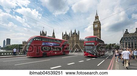 Stock Image - Two double decker buses on Westminster Bridge, Palace of Westminster, Houses of Parliament with Big Ben, City of Westminster London, England, United Kingdom, Europe. Fotosearch
