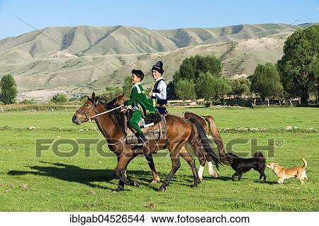 Two Kazakh riders in traditional clothes, Sati village, Tien Shan Mountains, Kazakhstan, Asia View Large Photo Image Picture - Two Kazakh riders in traditional clothes, Sati village, Tien Shan Mountains, Kazakhstan, Asia. Fotosearch