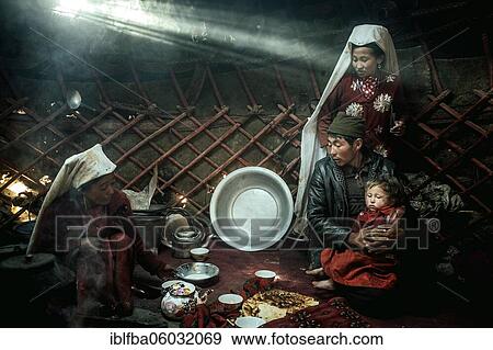 Two woman, a man and a child, morning meal, yurt, a ray of light falls in, nomadic Kyrgyz, Bozai Gumbaz, Wakhan corridor, Badakhshan, Afghanistan, Asia View Large Photo Image Stock Photo - Two woman, a man and a child, morning meal, yurt, a ray of light falls in, nomadic Kyrgyz, Bozai Gumbaz, Wakhan corridor, Badakhshan, Afghanistan, Asia. Fotosearch