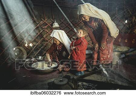 Two woman and a child in traditional Kyrgyz traditional traditional traditional traditional traditional traditional traditional traditional traditional costume, dough making for flat bread, in front of her a teakettle on a fireplace, yurt, bozai... View Large Photo Image Stock Photograph - Two woman and a child in traditional Kyrgyz traditional traditional traditional traditional traditional traditional traditional traditional traditional costume, dough making for flat bread, in front of her a teakettle on a fireplace, yurt, bozai.... Fotosearch