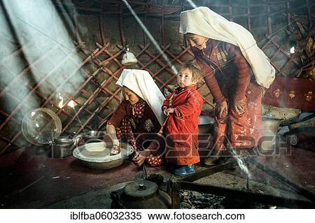 Two woman and a child in traditional Kyrgyz traditional traditional traditional traditional traditional traditional traditional traditional traditional costume, dough making for flat bread, in front of her a teakettle on a fireplace, yurt, bozai... View Large Photo Image Stock Photography - Two woman and a child in traditional Kyrgyz traditional traditional traditional traditional traditional traditional traditional traditional traditional costume, dough making for flat bread, in front of her a teakettle on a fireplace, yurt, bozai.... Fotosearch