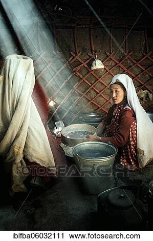 Two woman in traditional Kyrgyz traditional traditional traditional traditional traditional traditional traditional traditional traditional costume, making flat bread in a metal bowl, in front of them a bucket and a teakettle on a fireplace, yurt,... View Large Photo Image Stock Image - Two woman in traditional Kyrgyz traditional traditional traditional traditional traditional traditional traditional traditional traditional costume, making flat bread in a metal bowl, in front of them a bucket and a teakettle on a fireplace, yurt,.... Fotosearch