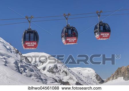 Télécabine Panoramic Mont-Blanc, opened in 1957, hovers 5km above the glacier between Aiguille du Midi and Pointe Helbronner, Mont Blanc massif, Chamonix-Mont-Blanc, Auvergne-Rhône-Alpes, France, Europe View Large Photo Image Stock Photo - Télécabine Panoramic Mont-Blanc, opened in 1957, hovers 5km above the glacier between Aiguille du Midi and Pointe Helbronner, Mont Blanc massif, Chamonix-Mont-Blanc, Auvergne-Rhône-Alpes, France, Europe. Fotosearch