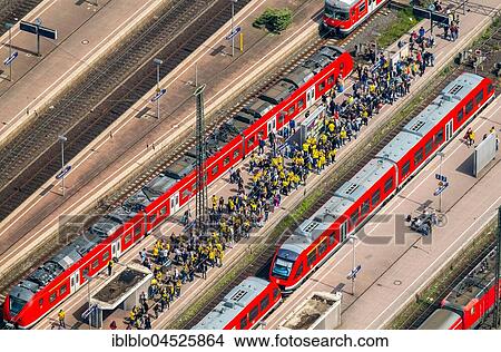 Picture - Urban railway, platform with BVB fans, Dortmund, Ruhr area, North Rhine-Westphalia, Germany, Europe. Fotosearch