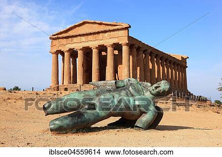 Valle dei Templi di Agrigento, Concordia temple with the sculpture of the crashed Icarus by the artist Igor Mitorgi, Agrigento, Sicily, Italy, Europe View Large Photo Image Picture - Valle dei Templi di Agrigento, Concordia temple with the sculpture of the crashed Icarus by the artist Igor Mitorgi, Agrigento, Sicily, Italy, Europe. Fotosearch