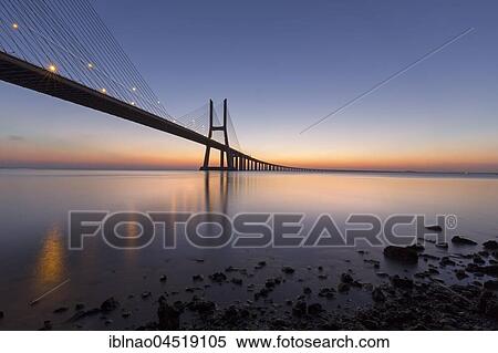 Stock Photography - Vasco da Gama Bridge over the river Tagus, evening red, Lisbon, Portugal, Europe. Fotosearch