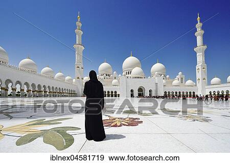 Veiled woman in front of the Sheikh-Zayed Mosque, Emirate Abu Dhabi, United Arab Emirates, Asia View Large Photo Image Stock Photo - Veiled woman in front of the Sheikh-Zayed Mosque, Emirate Abu Dhabi, United Arab Emirates, Asia. Fotosearch