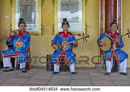 Vietnamese musicians in traditional robes of the court, Imperial Palace Hoang Thanh, Forbidden City, Hue, Vietnam, Asia View Large Photo Image Picture - Vietnamese musicians in traditional robes of the court, Imperial Palace Hoang Thanh, Forbidden City, Hue, Vietnam, Asia. Fotosearch