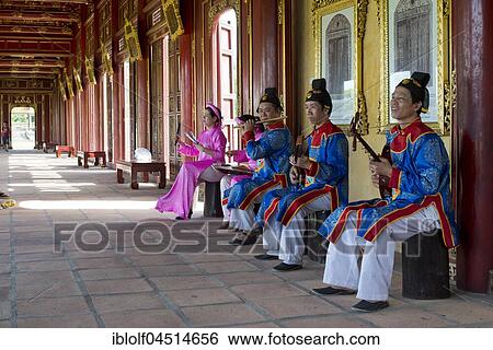 Stock Photograph - Vietnamese musicians in traditional robes of the court, Imperial Palace Hoang Thanh, Forbidden City, Hue, Vietnam, Asia. Fotosearch