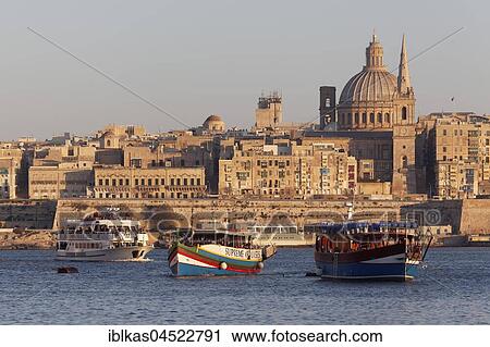 Stock Image - View from Sliema of Valletta and Marsamxett Harbor, evening light, Valletta, Malta, Europe. Fotosearch