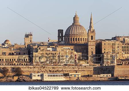 Stock Photo - View from Sliema of Valletta and Marsamxett Harbor, evening light, Valletta, Malta, Europe. Fotosearch