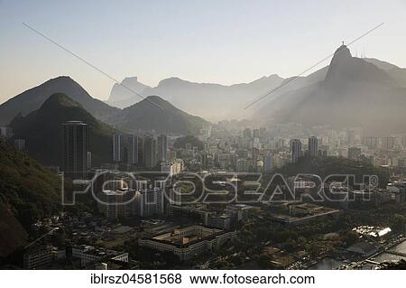 Stock Photo - View from the Sugar Loaf Mountain to the city and surrounding countryside in the evening light, Rio de Janeiro, Brazil, South America. Fotosearch