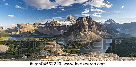 Stock Image - View from the summit of Mount Nublet on Mount Assiniboine, Mount Sunburst, Lake Magog, Lake Sunburst and Lake Cerulean, Canadian Rocky Mountains, Mount Assiniboine Provincial Park, British Columbia, Canada, North America. Fotosearch