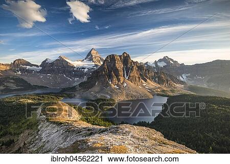 Stock Image - View from the summit of Mount Nublet on Mount Assiniboine, Mount Sunburst, Lake Magog, Lake Sunburst and Lake Cerulean, Canadian Rocky Mountains, Mount Assiniboine Provincial Park, British Columbia, Canada, North America. Fotosearch