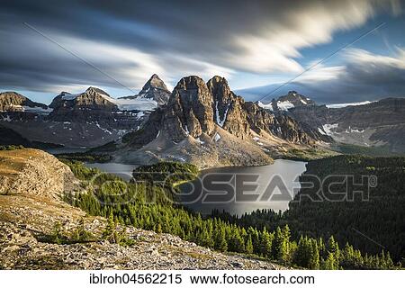 View from the summit of Mount Nublet on Mount Assiniboine, Mount Sunburst, Lake Magog, Lake Sunburst and Lake Cerulean, Canadian Rocky Mountains, Mount Assiniboine Provincial Park, British Columbia, Canada, North America View Large Photo Image Stock Photography - View from the summit of Mount Nublet on Mount Assiniboine, Mount Sunburst, Lake Magog, Lake Sunburst and Lake Cerulean, Canadian Rocky Mountains, Mount Assiniboine Provincial Park, British Columbia, Canada, North America. Fotosearch