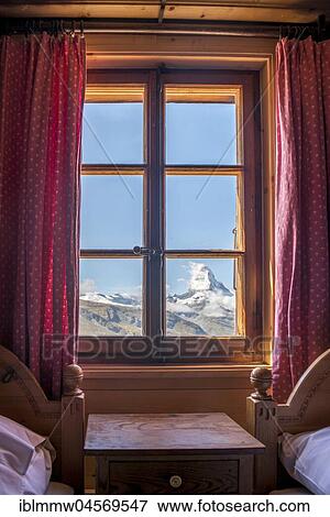 Stock Photo - View from the window to snow-covered Matterhorn, Fluhalp mountain lodge, Valais, Switzerland, Europe. Fotosearch