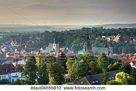 Stock Image - View of Eisleben, cityscape, left Luther's Baptismal Church, on the right Church of St. Andrew, Luther city Eisleben, Saxony-Anhalt. Fotosearch