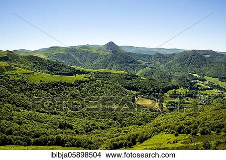 Picture - View of the Mandailles valley and Puy Griou in the Auvergne volcanoes regional natural park, Cantal, Auvergne Rhone Alpes, France, Europe. Fotosearch