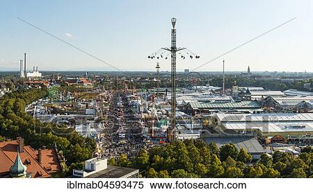 Stock Photography - View of the Oktoberfest with fairground rides and pavilions, Wiesn, Munich, Upper Bavaria, Bavaria, Germany, Europe. Fotosearch