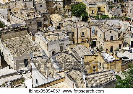 Stock Photo - View of the old town cut out of the stone, the so-called Sassi of Matera, Basilicata, Italy, Europe. Fotosearch